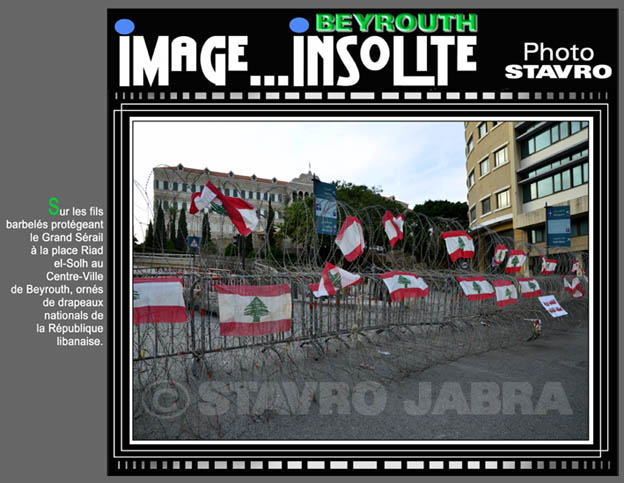 photo stavro - Sur les fils barbels protgeant le Grand Srail au Centre-Ville de Beyrouth, orns de drapeaux libanais