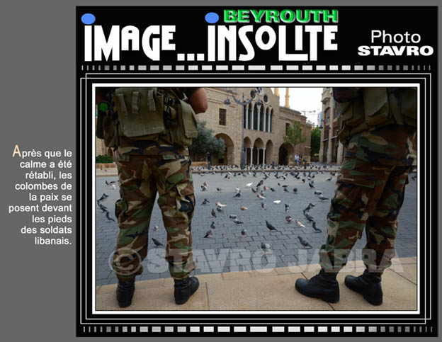 photo stavro-Aprs que le calme a t rtabli, les colombes de la paix se posent devant les pieds des soldats libanais.
